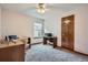 Bright bedroom perfect for an office space, featuring a large window and two desks at 8426 W 97Th Pl, Broomfield, CO 80021