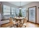 Bright breakfast nook with light-filled windows and access to the backyard patio at 8426 W 97Th Pl, Broomfield, CO 80021