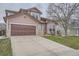 Charming two-story home with a two-car garage and well-maintained lawn at 8426 W 97Th Pl, Broomfield, CO 80021