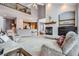 Spacious living room featuring a fireplace and bar area, providing plenty of space for relaxation and entertainment at 8426 W 97Th Pl, Broomfield, CO 80021
