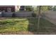 Well-maintained backyard featuring lush green grass and privacy fence at 4995 S Algonquian Way, Aurora, CO 80016