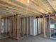 Unfinished basement featuring wooden framing, exposed ceiling beams and concrete floor at 4995 S Algonquian Way, Aurora, CO 80016