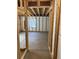 Unfinished basement with wooden framing and poured concrete flooring ready to be custom designed at 4995 S Algonquian Way, Aurora, CO 80016