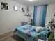 Comfortable bedroom featuring a full-size bed, dresser, and playful decor at 4995 S Algonquian Way, Aurora, CO 80016