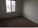 Cozy bedroom with plush carpet and window with blinds allowing soft light at 4995 S Algonquian Way, Aurora, CO 80016
