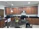 Spacious kitchen featuring wood cabinets, granite countertops, and stainless steel appliances at 4995 S Algonquian Way, Aurora, CO 80016