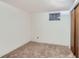 An unfurnished bedroom with carpeted floors and a small window at 1101 Dakin St, Denver, CO 80221