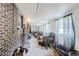 Spacious unfinished basement featuring brick walls, tile floors, and abundant natural light at 1101 Dakin St, Denver, CO 80221