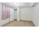 A basic bedroom with carpet, a light and closet at 1101 Dakin St, Denver, CO 80221
