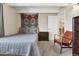 Bedroom features a comfortable bed, unique decor, and carpeted floors at 33 N Corona St # 404, Denver, CO 80218