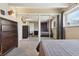 Bedroom showcases mirrored closet doors reflecting the room's decor at 33 N Corona St # 404, Denver, CO 80218