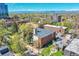 Apartment building featuring brick facade and lush landscaping with an inviting private swimming pool at 33 N Corona St # 404, Denver, CO 80218