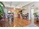 Kitchen and dining room with hardwood floors, light wood cabinets and stainless appliances at 33 N Corona St # 404, Denver, CO 80218