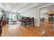 Living room with hardwood floors and a mirrored closet featuring lots of natural light at 33 N Corona St # 404, Denver, CO 80218