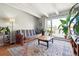 Open living space with a beamed ceiling, hardwood floors and lots of natural light at 33 N Corona St # 404, Denver, CO 80218