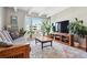Living room featuring hardwood floors, beamed ceiling, and lots of natural light at 33 N Corona St # 404, Denver, CO 80218
