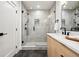 Bathroom featuring a glass enclosed shower with a rainfall showerhead and modern vanity at 1745 Lowell Blvd, Denver, CO 80204