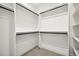 Walk-in closet featuring built-in shelving and hanging racks at 1745 Lowell Blvd, Denver, CO 80204