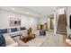 Spacious living room features a plush sectional sofa, coffee table, and bar area with beverage cooler at 1745 Lowell Blvd, Denver, CO 80204