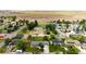 Expansive aerial view of residential neighborhood and lush green lawns at 1853 Burton St, Strasburg, CO 80136
