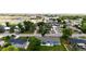 Aerial view of neighborhood showcasing the home's curb appeal and green backyard at 1853 Burton St, Strasburg, CO 80136