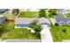 Aerial shot of the home showing the well-maintained lawn, fenced backyard, and neighborhood at 1853 Burton St, Strasburg, CO 80136