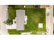Aerial view of a home featuring a large backyard, patio, landscaping and parking at 1853 Burton St, Strasburg, CO 80136