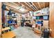 Unfinished basement with ample storage space and shelving for boxes and personal items at 1853 Burton St, Strasburg, CO 80136