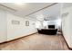 This is a large carpeted basement with a brown sofa and recessed lighting, ideal for entertaining at 1853 Burton St, Strasburg, CO 80136