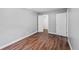Clean bedroom with hardwood floors and multiple closets at 17004 E Tennessee Dr # 103, Aurora, CO 80017
