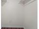 A closet features white walls, wood floors, and a hanging rod at 17004 E Tennessee Dr # 103, Aurora, CO 80017