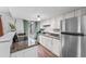 Well-lit kitchen with stainless steel appliances and granite countertops at 17004 E Tennessee Dr # 103, Aurora, CO 80017