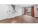 The living room with wood floors has a large window and access to the patio at 17004 E Tennessee Dr # 103, Aurora, CO 80017