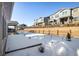 View of backyard and neighboring homes covered in snow at 21837 E Stanford Cir, Aurora, CO 80015