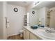 Clean bathroom with single sink vanity and shower/tub combo at 21837 E Stanford Cir, Aurora, CO 80015