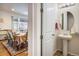 Small bathroom with pedestal sink and mirrored vanity at 21837 E Stanford Cir, Aurora, CO 80015