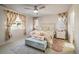 Main bedroom with floral bedding and ample natural light at 21837 E Stanford Cir, Aurora, CO 80015