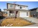 Two-story house with attached garage and landscaped front yard at 21837 E Stanford Cir, Aurora, CO 80015