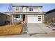 Two-story house with attached garage and landscaped front yard at 21837 E Stanford Cir, Aurora, CO 80015