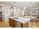 Modern kitchen with white cabinets, stainless steel appliances, and island at 21837 E Stanford Cir, Aurora, CO 80015