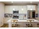 Modern kitchen with stainless steel appliances and white cabinetry at 21837 E Stanford Cir, Aurora, CO 80015
