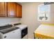 Laundry room with washer, dryer, and extra folding counter space at 21837 E Stanford Cir, Aurora, CO 80015
