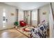 Bright living room with hardwood floors, comfortable seating, and a staircase at 21837 E Stanford Cir, Aurora, CO 80015