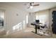 Home office featuring a standing desk and plenty of natural light at 21837 E Stanford Cir, Aurora, CO 80015