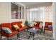 Relaxing sunroom furnished with comfortable seating at 21837 E Stanford Cir, Aurora, CO 80015