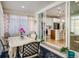 Bright sunroom with access to the backyard and seating area at 21837 E Stanford Cir, Aurora, CO 80015