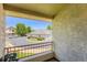 View from the balcony showing a parking lot and a building with a gray tiled roof at 22560 E Ontario Dr # 204, Aurora, CO 80016
