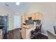 Modern kitchen featuring granite countertops, stainless steel appliances, and a convenient breakfast bar at 22560 E Ontario Dr # 204, Aurora, CO 80016