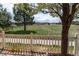 A relaxing view from the back patio overlooks a sprawling green lawn leading to an open field at 3760 Ute Mountain Trl, Castle Rock, CO 80109
