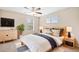 Bright bedroom with a ceiling fan, modern furniture, and a large window with blinds at 3760 Ute Mountain Trl, Castle Rock, CO 80109